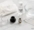 Vape maintenance guide: cleaning tools and disassembled tank parts on white surface